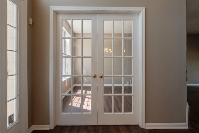 6512 N Fisk Ct, Kansas City, MO 64151 - doorway to outside with french doors, baseboards, and wood finished floors