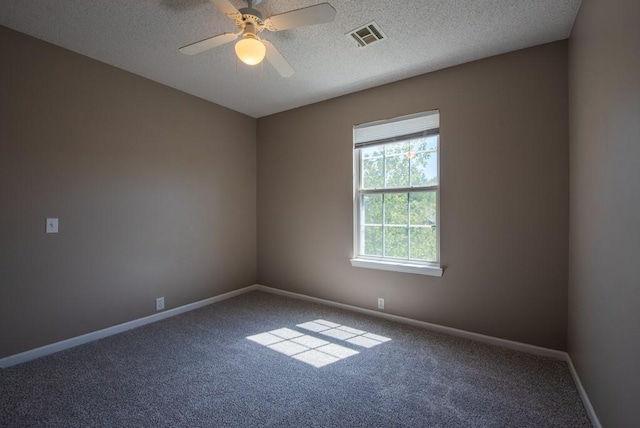 6512 N Fisk Ct, Kansas City, MO 64151 - carpeted spare room with baseboards, a textured ceiling, and a ceiling fan