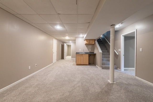 6512 N Fisk Ct, Kansas City, MO 64151 - finished below grade area with light carpet, stairway, and baseboards