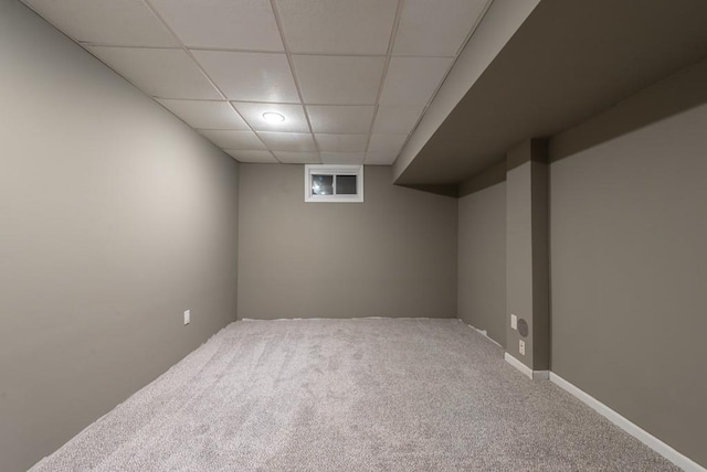 6512 N Fisk Ct, Kansas City, MO 64151 - basement featuring a drop ceiling and carpet