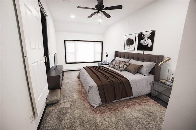 bedroom with ceiling fan, vaulted ceiling, carpet flooring, and a barn door