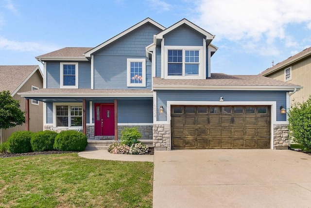 1024 Tamarisk Dr, Leavenworth, KS 66048 - craftsman-style home featuring stone siding, driveway, a porch, a garage, and a front yard