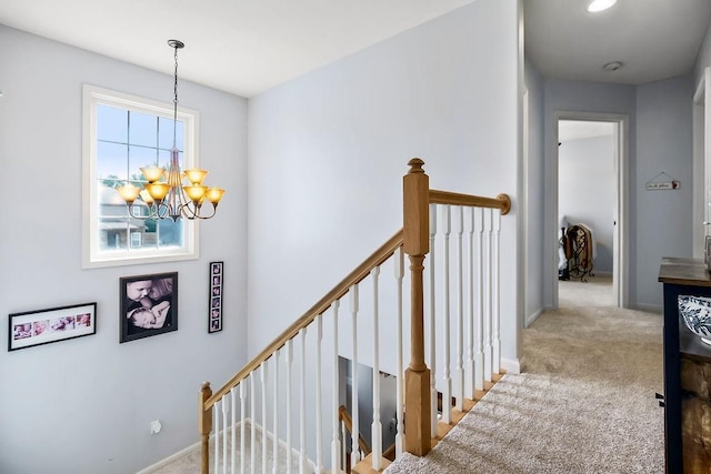 1024 Tamarisk Dr, Leavenworth, KS 66048 - stairway featuring a chandelier, carpet, and baseboards