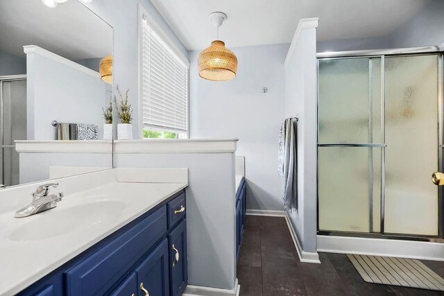 1024 Tamarisk Dr, Leavenworth, KS 66048 - full bathroom with vanity, a shower with door, tile patterned flooring, and baseboards
