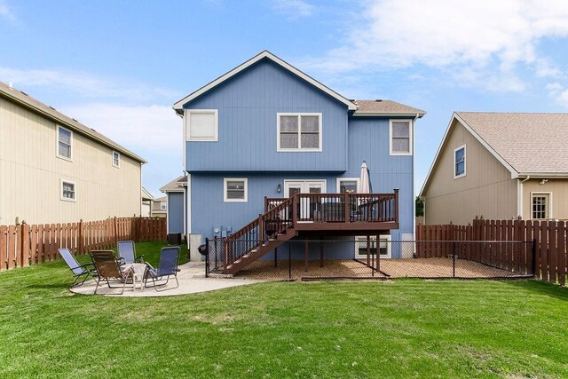 1024 Tamarisk Dr, Leavenworth, KS 66048 - back of house with stairway, a patio area, and a deck
