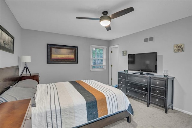 bedroom featuring light carpet, ceiling fan, and baseboards