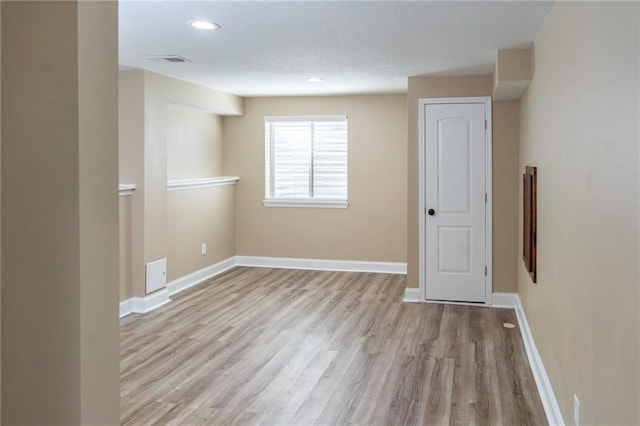 2200 NW Hedgewood Dr, Grain Valley, MO 64029 - unfurnished room with wood finished floors, baseboards, and recessed lighting