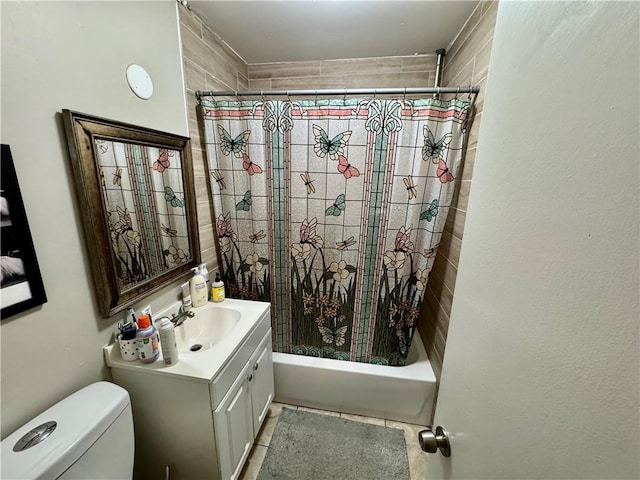bathroom featuring vanity, shower / tub combo with curtain, tile patterned flooring, and toilet
