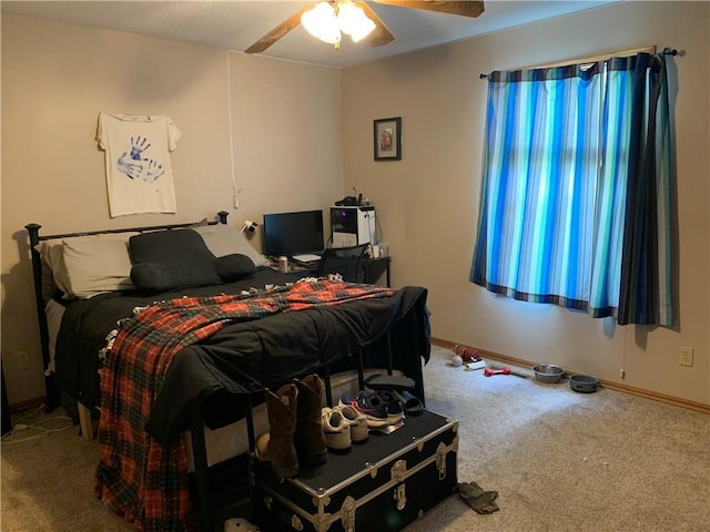 bedroom featuring baseboards, ceiling fan, and carpet