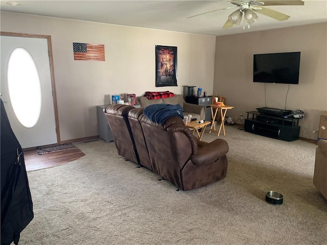carpeted living room with ceiling fan