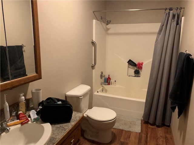 full bathroom with vanity, toilet, wood finished floors, and shower / tub combo with curtain