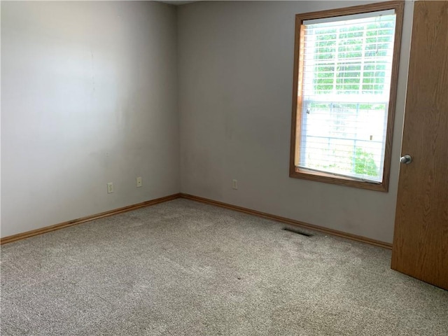1019 S Hugh St, Frontenac, KS 66763 - carpeted spare room featuring healthy amount of natural light