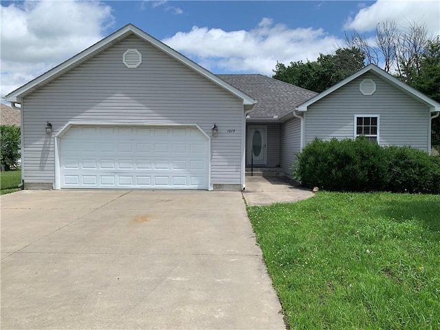 1019 S Hugh St, Frontenac, KS 66763 - single story home with driveway, a front yard, and a garage