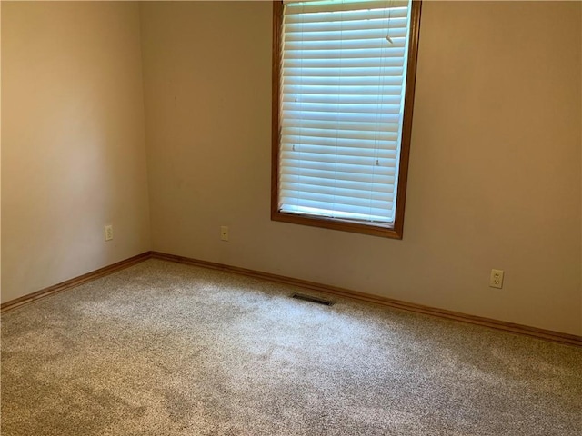 1019 S Hugh St, Frontenac, KS 66763 - carpeted empty room featuring baseboards