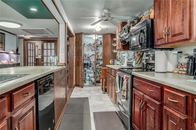 kitchen with light countertops, a ceiling fan, visible vents, and black appliances