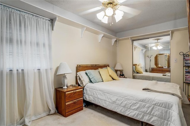 bedroom featuring carpet flooring, a ceiling fan, and a closet