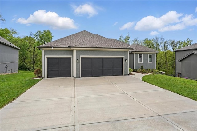ranch-style home featuring a shingled roof, a garage, stucco siding, a front yard, and driveway