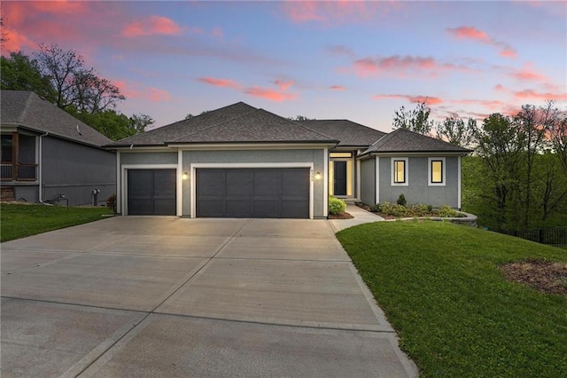 ranch-style house with a lawn, roof with shingles, stucco siding, concrete driveway, and an attached garage