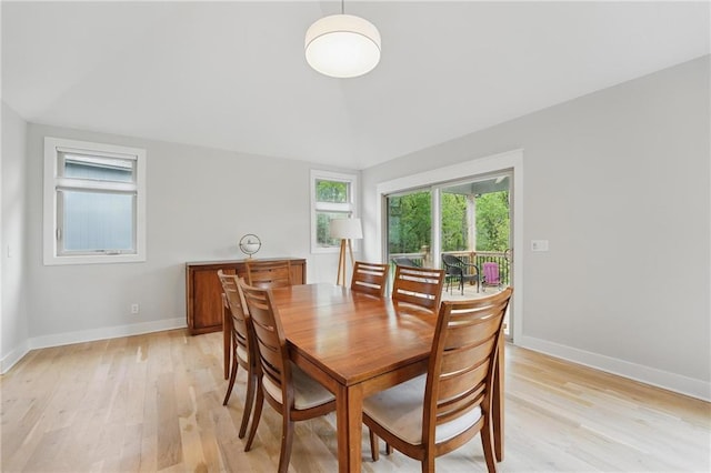 dining room featuring baseboards and light wood-style flooring