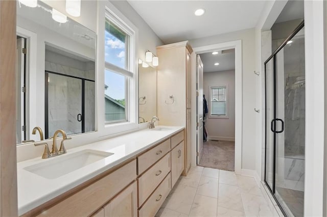 full bathroom featuring a sink, plenty of natural light, and marble finish floor