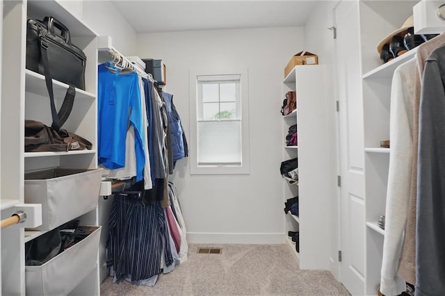spacious closet with visible vents and carpet
