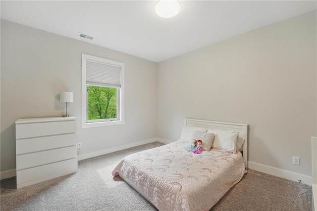 bedroom featuring visible vents, carpet flooring, and baseboards