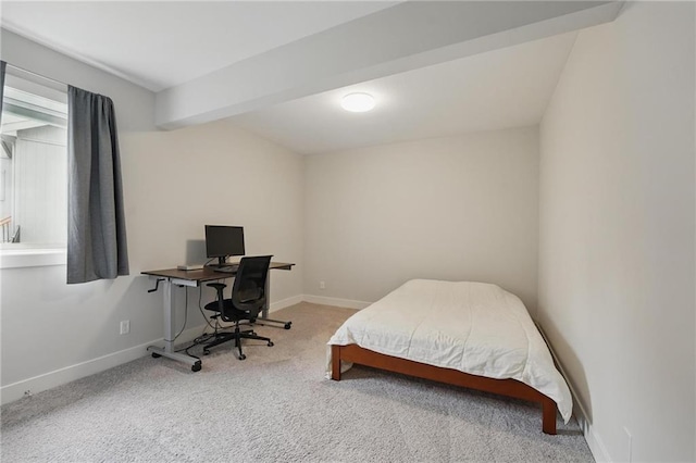 carpeted bedroom featuring baseboards