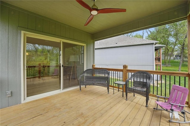 wooden terrace featuring ceiling fan