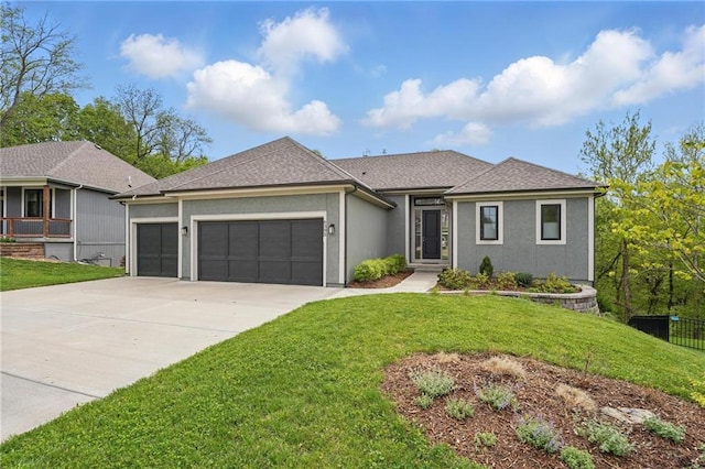 view of front facade with a front lawn, roof with shingles, stucco siding, concrete driveway, and an attached garage