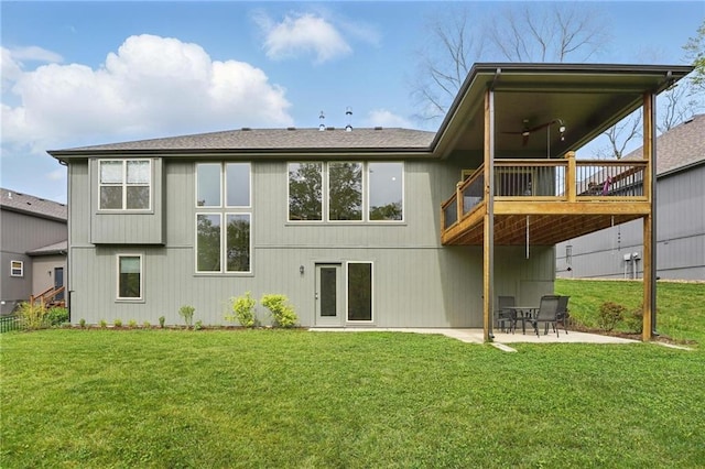 back of house featuring a lawn, a ceiling fan, a patio, and a deck