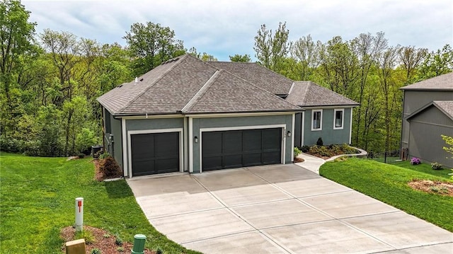 ranch-style home with concrete driveway, stucco siding, a front lawn, and a garage