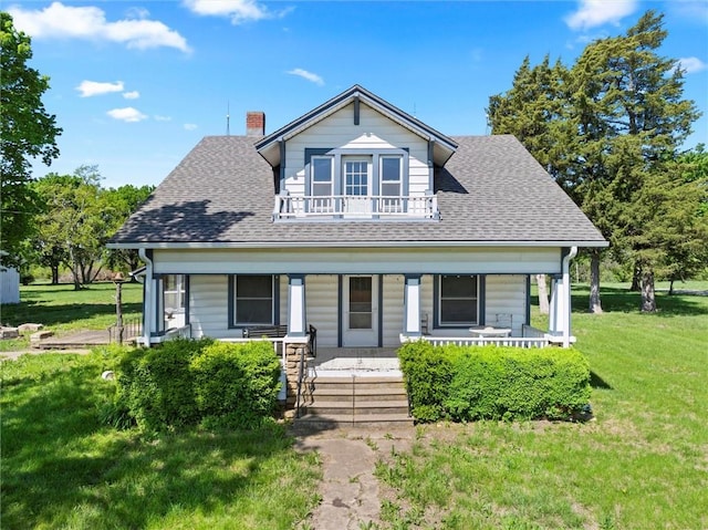 657 N 400th Rd, Overbrook, KS 66524 - bungalow-style home with covered porch, a shingled roof, a front yard, and a balcony
