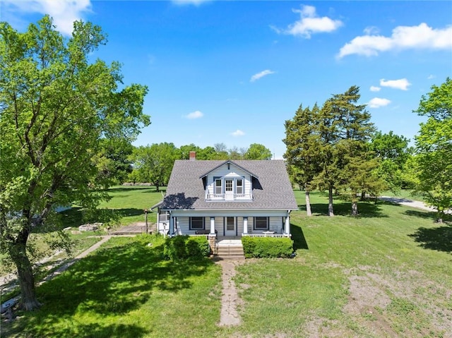 657 N 400th Rd, Overbrook, KS 66524 - view of front facade featuring covered porch, a front yard, and a chimney