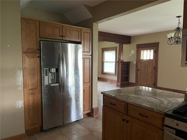 657 N 400th Rd, Overbrook, KS 66524 - kitchen with appliances with stainless steel finishes, stone counters, light tile patterned floors, baseboards, and a chandelier