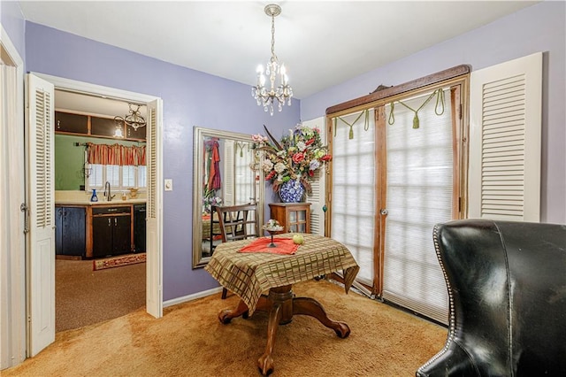 636 S Fuller Ave, Independence, MO 64052 - dining space featuring carpet flooring, plenty of natural light, a chandelier, and baseboards