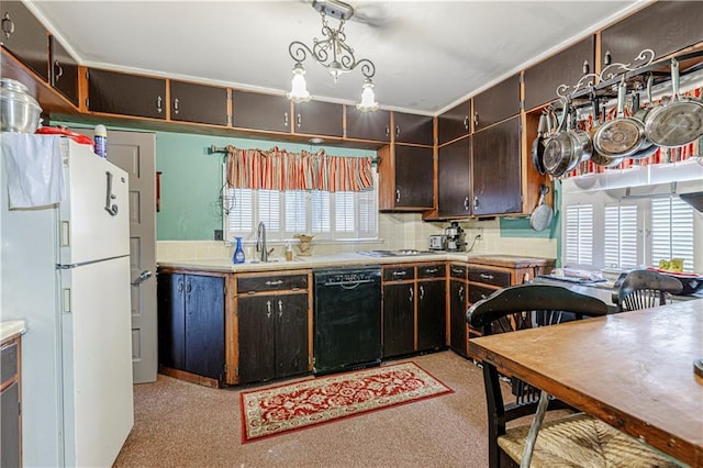 636 S Fuller Ave, Independence, MO 64052 - kitchen with black dishwasher, freestanding refrigerator, plenty of natural light, and a sink
