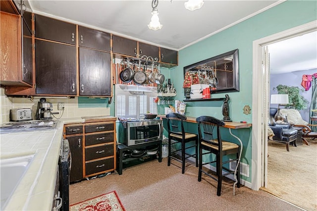 636 S Fuller Ave, Independence, MO 64052 - office area featuring light colored carpet, a sink, and crown molding