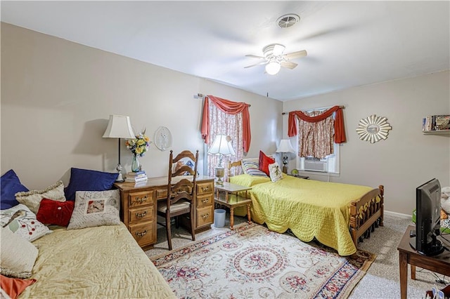 636 S Fuller Ave, Independence, MO 64052 - carpeted bedroom with cooling unit and a ceiling fan