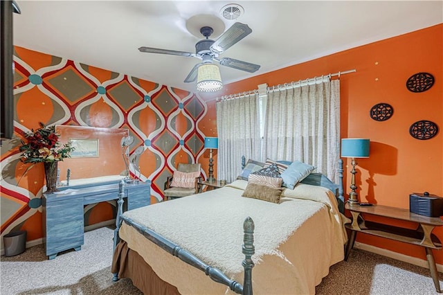 636 S Fuller Ave, Independence, MO 64052 - carpeted bedroom with baseboards and a ceiling fan