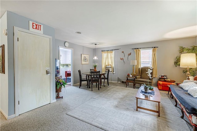 636 S Fuller Ave, Independence, MO 64052 - carpeted living area with baseboards