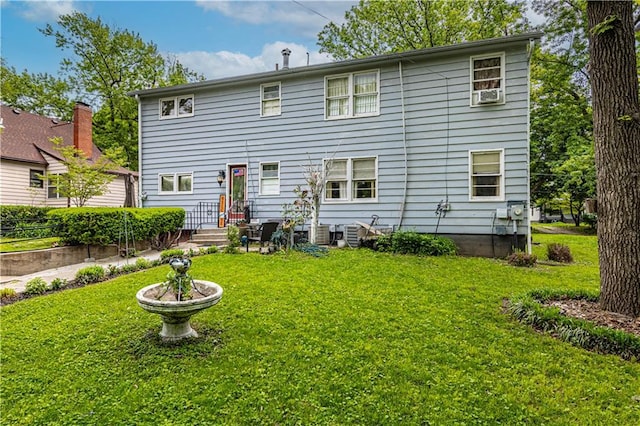 636 S Fuller Ave, Independence, MO 64052 - rear view of property with a yard
