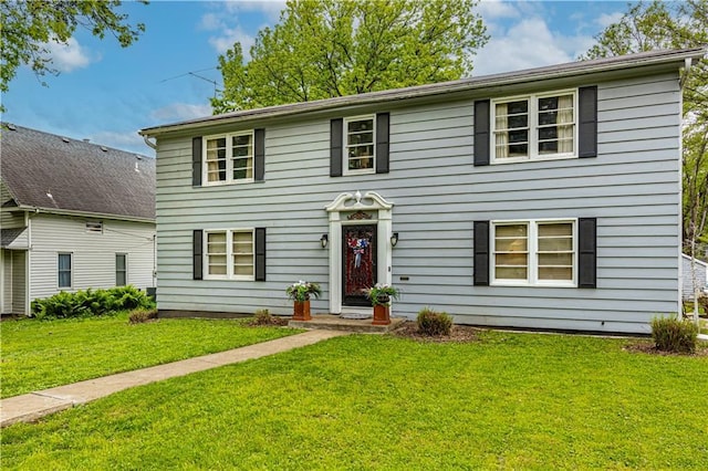 636 S Fuller Ave, Independence, MO 64052 - colonial-style house with a front lawn