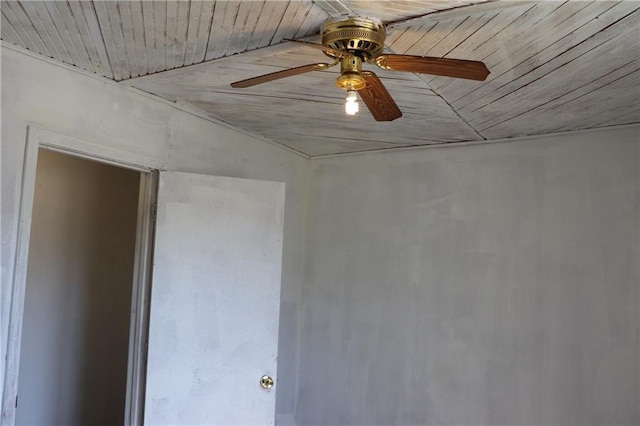 empty room featuring ceiling fan and wood ceiling