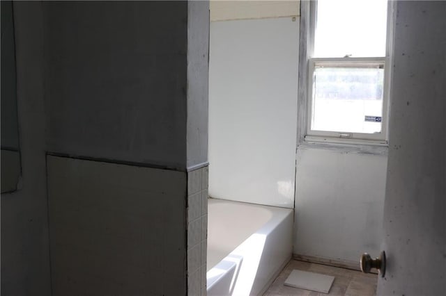 bathroom featuring a tub to relax in