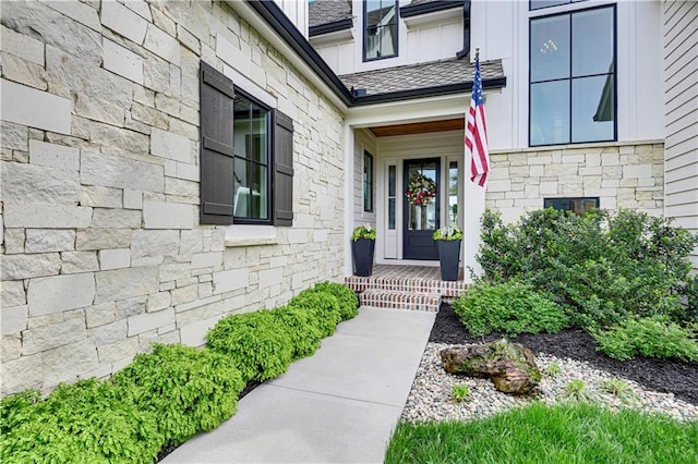 entrance to property featuring stone siding