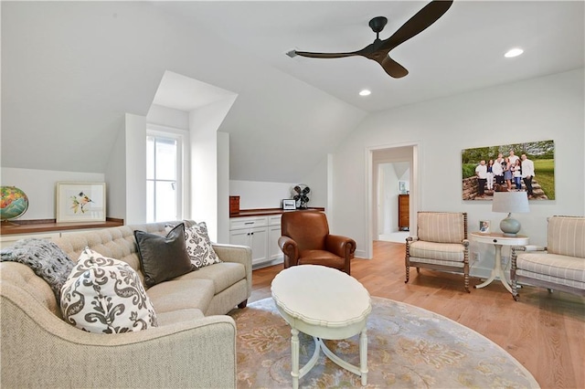 living area with a ceiling fan, recessed lighting, light wood finished floors, and lofted ceiling