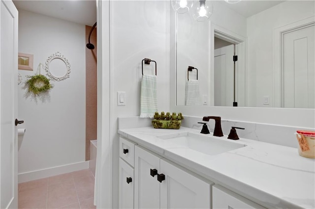 full bathroom featuring tile patterned floors, baseboards, and vanity
