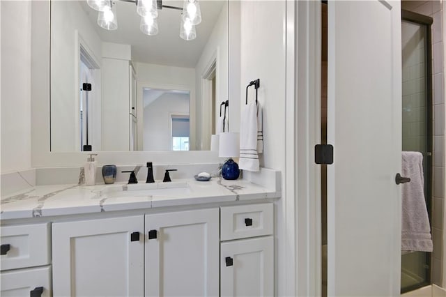 full bathroom featuring vanity and a shower stall
