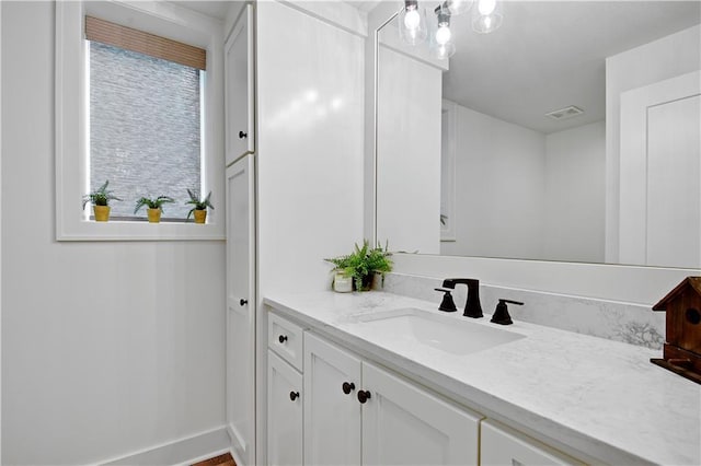 bathroom with visible vents and vanity