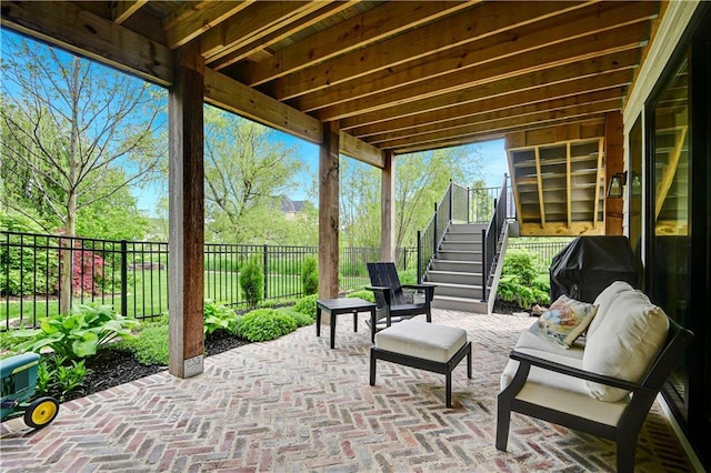 view of patio / terrace with a fenced backyard and stairway